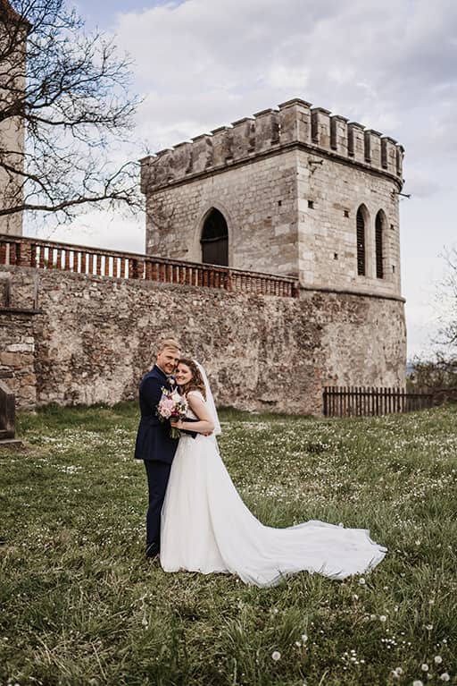 Bridal couple in front of the bell tower