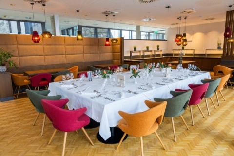 Table setting in dining room 2 at Schloss Seggau with white tablecloth.