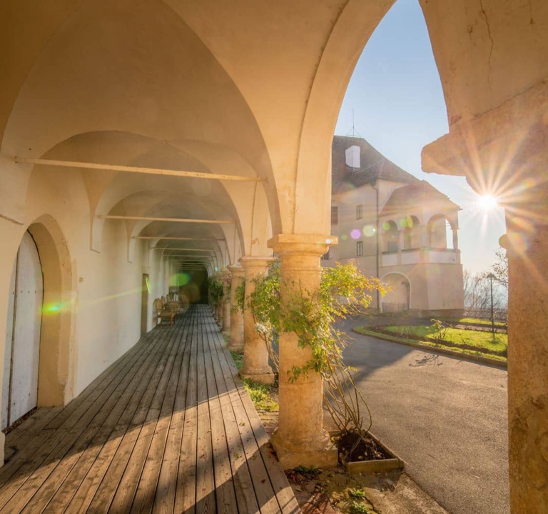 The view is across the upper castle courtyard arcade towards the sisters' flat.